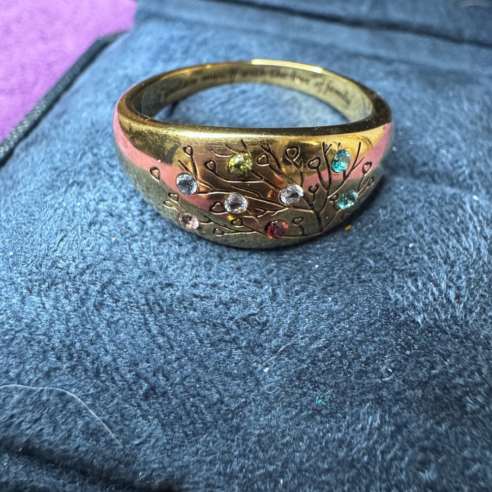 Elegant Gold toned ring with multiple Gem Accents